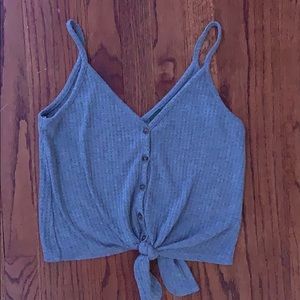 grey button up, tied tank top